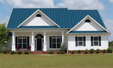 blue house white trim brown metal roof|blue metal roof homes.